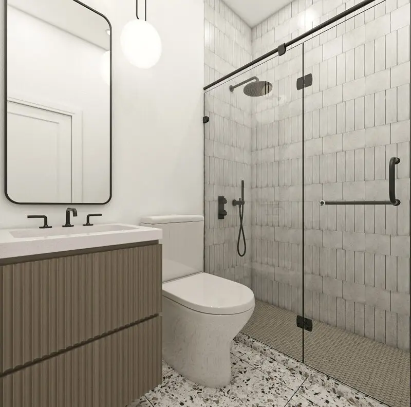 Modern bathroom with glass shower and vanity.