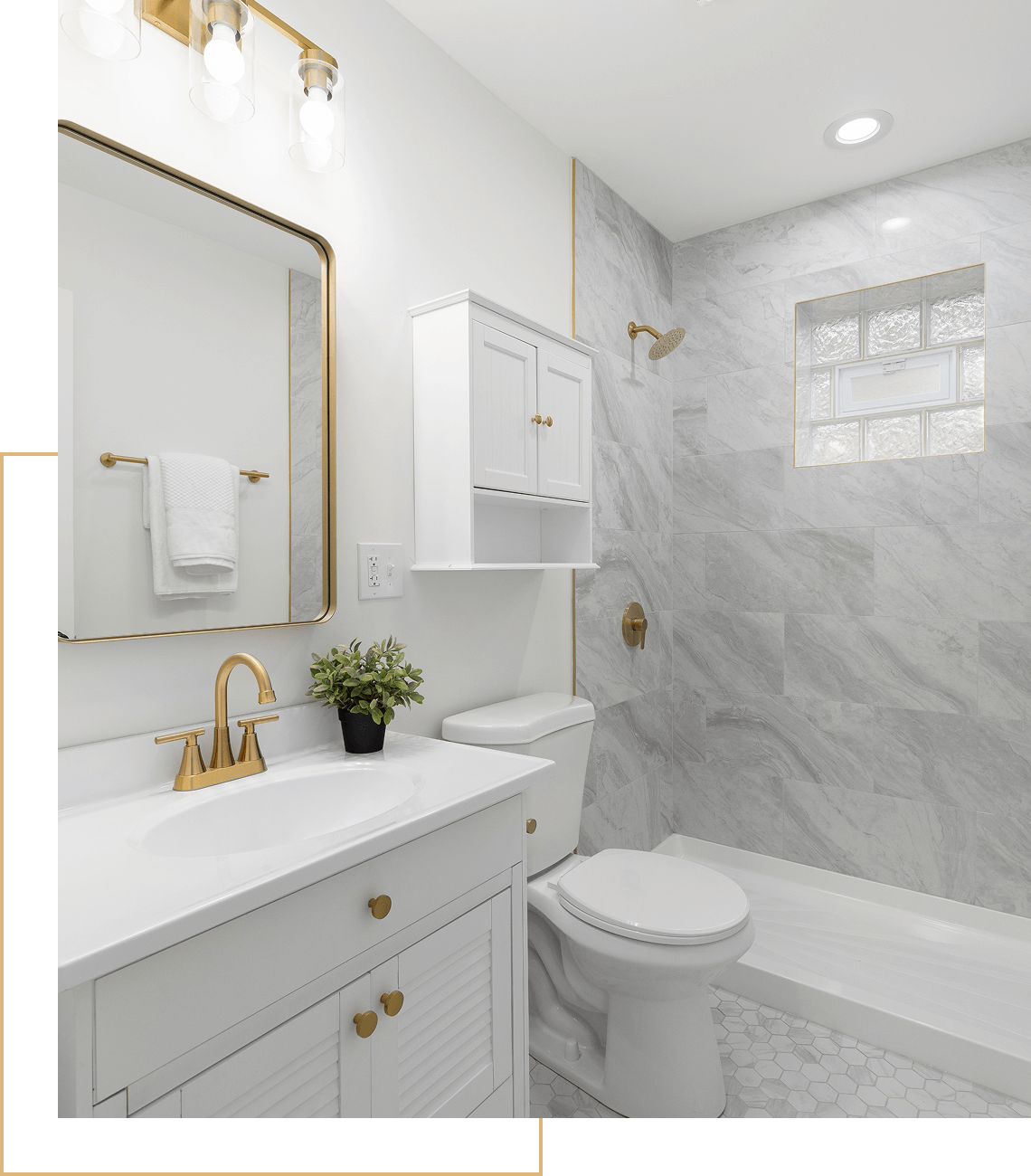 Modern white bathroom with gold fixtures.