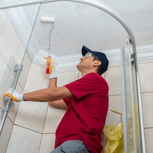 Bathroom remodeling experts working on a renovation in a house in NH.
